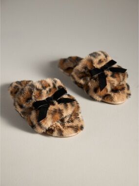 Anthropologie’s Maeve Leopard-Print Faux-Fur Open-Toe Slippers with Black Bow